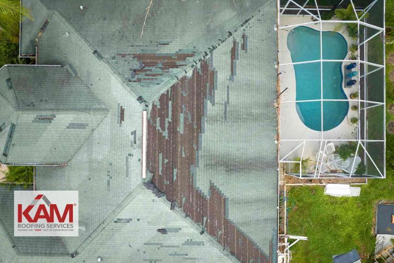 A Florida roof damaged by high winds from a seasonal storm