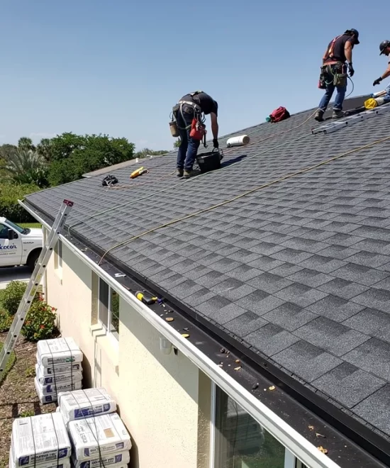 Workers working on a roof installation in Pinellas County